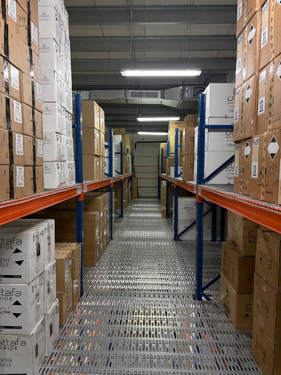 Narrow storage aisle with cartons on both sides