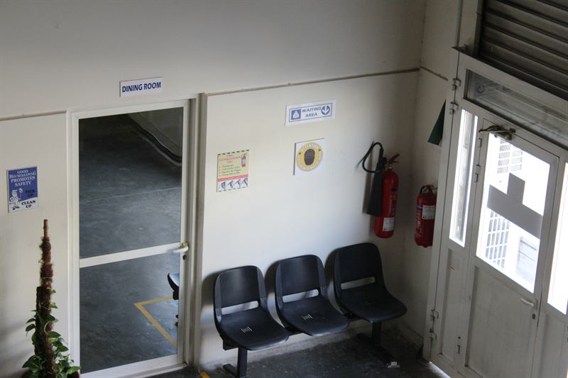 Fire extinguishers and safety signage at the warehouse entrance