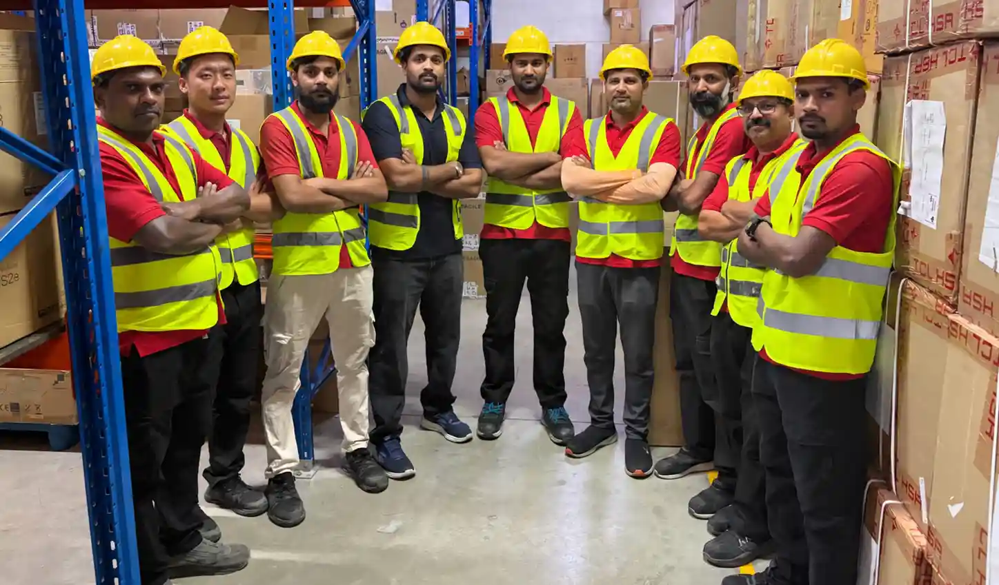 The Enthusiasm warehouse team in a racking aisle at the Al Quoz warehouse